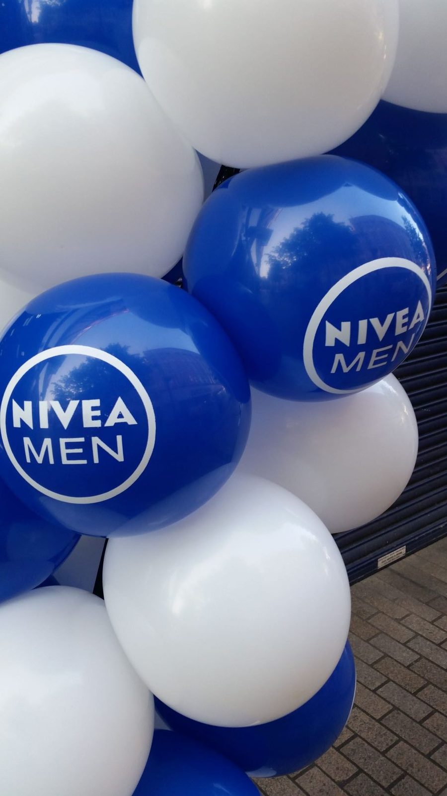 Nivea branded balloon arch built from top-printed balloons by The Balloon Printers
