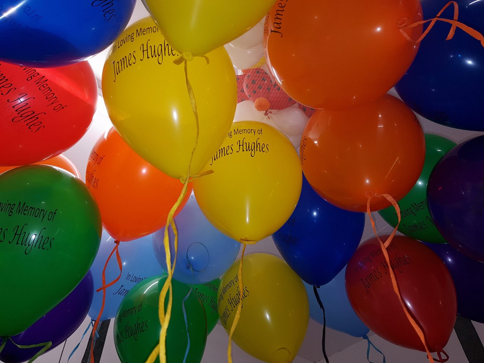 Bulk pack of budget 12 inch printed latex balloons with a company logo
