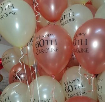 Printed pearl and metallic 11 inch Qualatex latex balloons with a logo printed in Lisburn